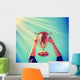 Man Holding up Gold Wall Decal