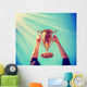 Man Holding up Gold Wall Decal