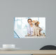 Veterinarian. Vet using technology with a little dog - isolated Wall Mural