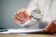 Businessman with Magnifying Glass Wall Decal