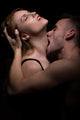 Man Biting Woman's Neck Wall Decal