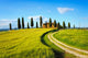 Tuscany, farmland, cypress trees and white road on sunset. Siena Wall Mural