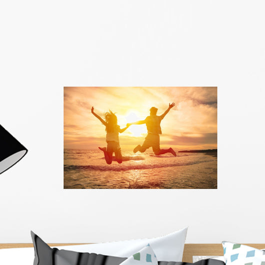 Young Happy Couple Jumping Wall Decal