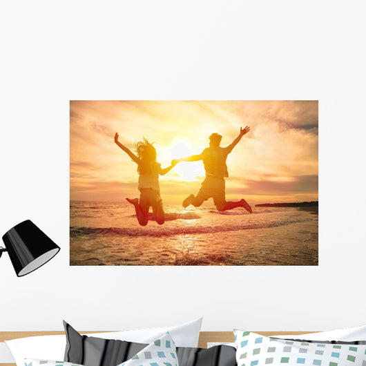 Young Happy Couple Jumping Wall Decal