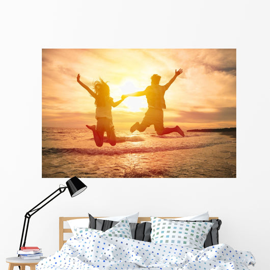 Young Happy Couple Jumping Wall Decal