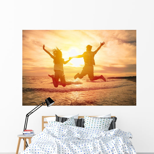 Young Happy Couple Jumping Wall Decal