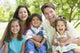 Laughing Family Sitting Outdoors Wall Decal