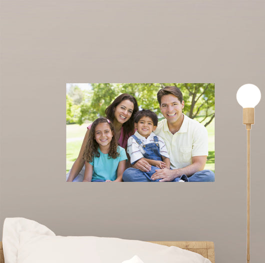 Smiling Family Sitting Outdoors Wall Decal