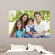 Smiling Family Sitting Outdoors Wall Decal