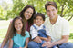 Smiling Family Sitting Outdoors Wall Decal