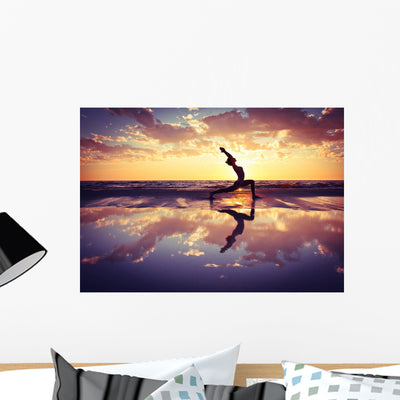 Silhouetted Woman Practicing Yoga on the Beach Wall Decal shown on a wall