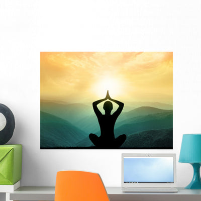 Yoga and Meditation Silhouette Wall Decal shown on a wall