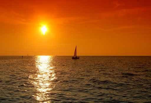 Yacht Sailing into Sunset Wall Decal
