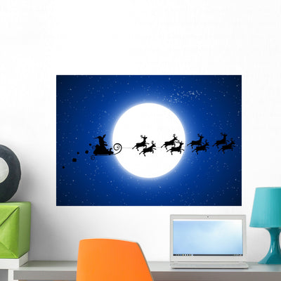 Santa Claus Flying Christmas Wall Decal shown on a wall