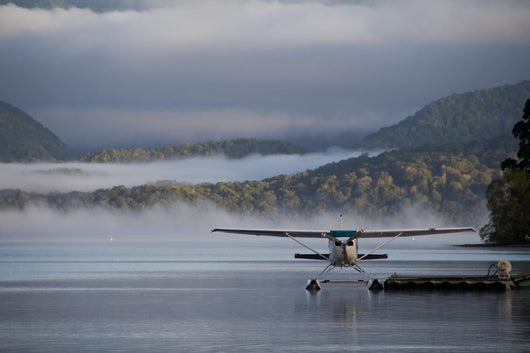 Landed Waterplane Foggy Hills Wall Decal