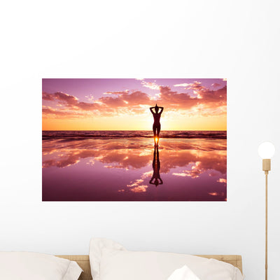 Woman Practicing Yoga Wall Decal shown on a wall