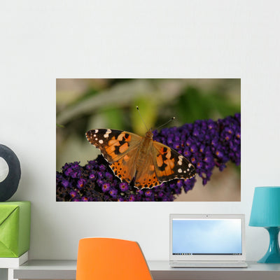 Purple Flowers Butterfly Wall Decal shown on a wall