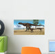 Carnotaurus Mother Brings Her Wall Decal
