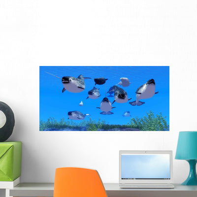 Pod Narwhal Whales Swim Wall Decal Design 1 shown on a wall