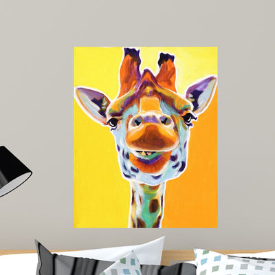 Grinning Giraffe Wall Mural shown on a wall