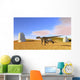 Utahraptor Running across Grassy Wall Decal