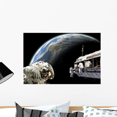 Astronauts Performing Work Space Shadow Earth Wall Decal shown on a wall