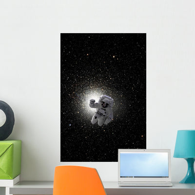 Astronaut Floating Deep Space Vertical Wall Decal shown on a wall