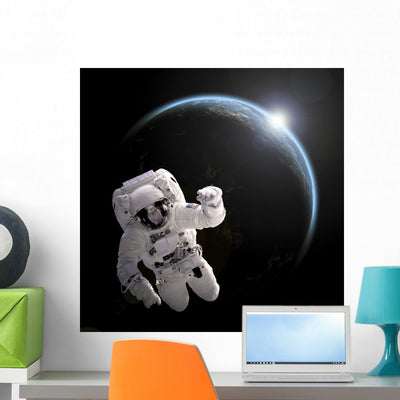 Astronaut Floating Space as Wall Decal shown on a wall