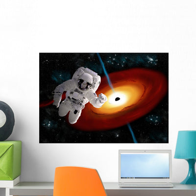 Astronaut Floating Outer Space Wall Decal shown on a wall