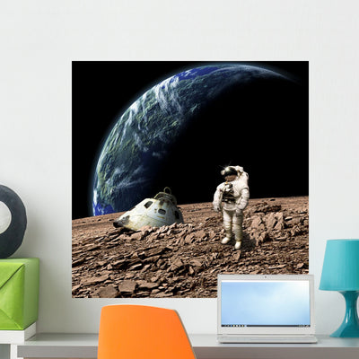Astronaut Surveys His Situation Rocky Planet Wall Decal shown on a wall