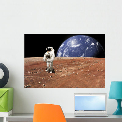 Astronaut Standing Barren World Horizontal Wall Decal shown on a wall
