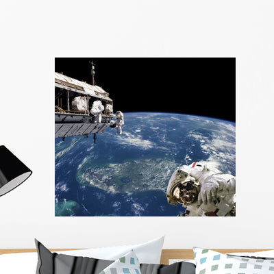 Astronauts Performing Work Space Earth Wall Decal shown on a wall