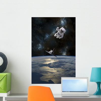 Astronaut Drifting Space Is Vertical Wall Decal shown on a wall