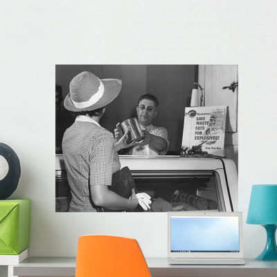 Woman Donates Her Cooking Wall Decal shown on a wall