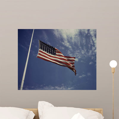 American Flag Waving Wind Wall Decal Design 1 shown on a wall