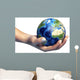 Human Hand Holding Planet Wall Decal