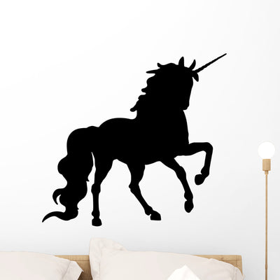 Prancing Black Unicorn Silhouette Wall Decal shown on a wall