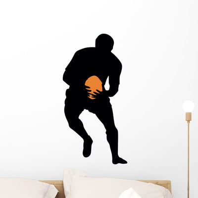 Football Silhouette Wall Decal shown on a wall