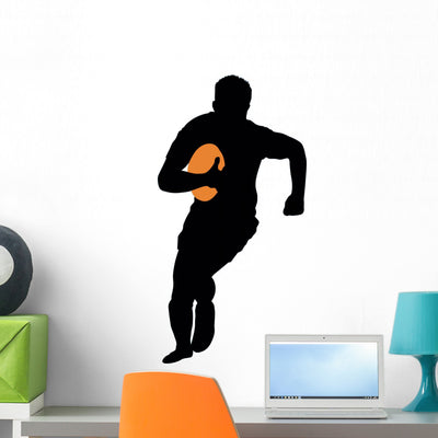 Football Silhouette Wall Decal shown on a wall