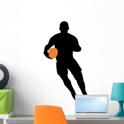 Football Silhouette Wall Decal shown on a wall