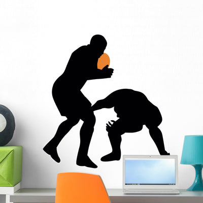 Football Silhouette Wall Decal shown on a wall