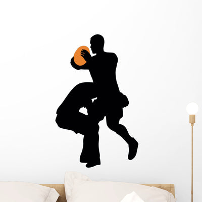 Football Silhouette Wall Decal shown on a wall