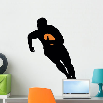 Football Silhouette Wall Decal shown on a wall