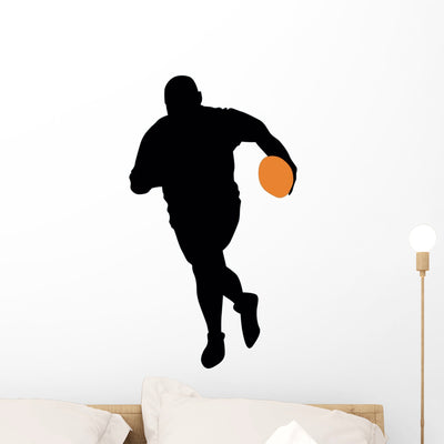 Football Silhouette Wall Decal shown on a wall