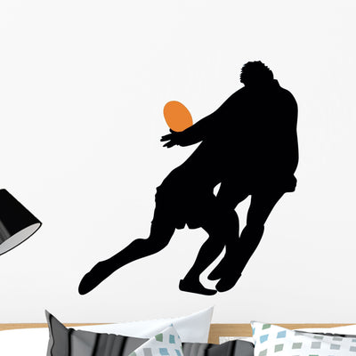 Football Silhouette Wall Decal shown on a wall