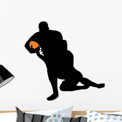 Football Silhouette Wall Decal shown on a wall