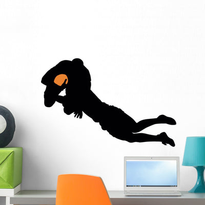 Football Silhouette Wall Decal shown on a wall
