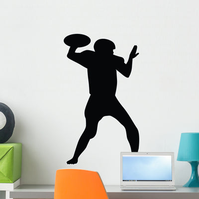 Quarterback Football Silhouette Wall Decal shown on a wall