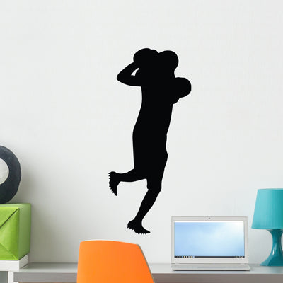 Football Silhouette Wall Decal shown on a wall