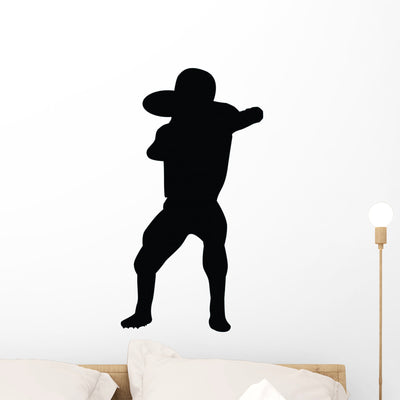 Football Silhouette Wall Decal shown on a wall